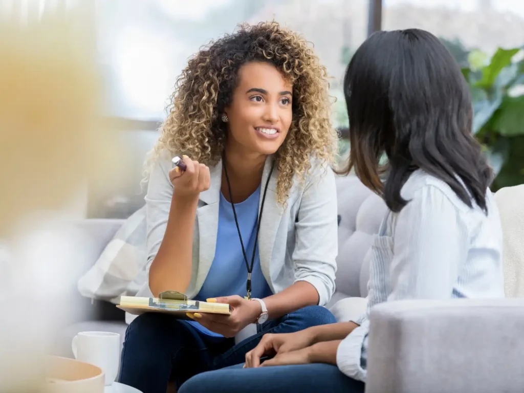 A compassionate therapist engages in a thoughtful conversation with a client, creating a safe and supportive space for psychoanalytic therapy in Los Angeles.